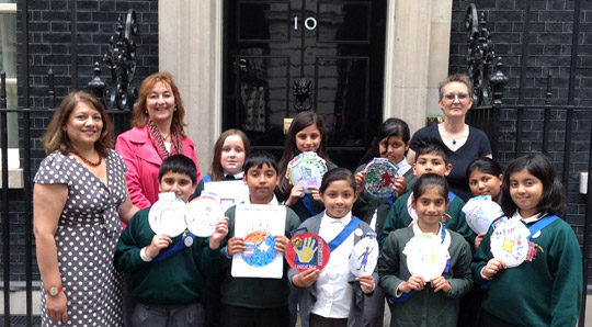 Group of schoolchildren and adults outside 10 Downing Street